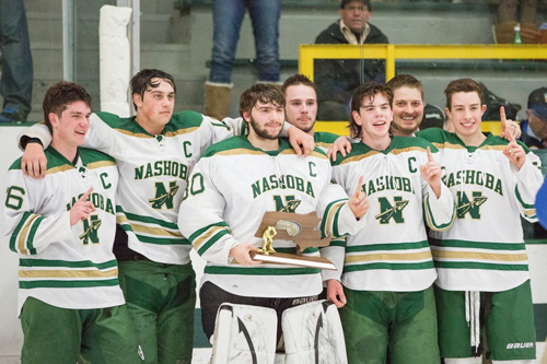On Monday night, Nashoba hockey won the Division Championship for the first time since 1980. Pictured with the  CMass Div. 3A Championship trophy are: (L-R)  #16 Jack Charbonneau (Senior, Captain), #10 Brad Colvin (Junior, Captain), #30 Luke Gilchrest (Senior, Captain), #9 Kevin Gilchrest (Senior, Captain), #21 Hunter Boudreau (Senior, Captain), Head Coach Trevor Short, and #26 P.J. Anastas (Senior, Captain).                                                                                                                                                        Susan Shaye; susanshaye.com