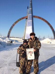 Fredda Cole (Stow) and Russ Fitch at the Arctic Circle in Salekhard, Russia at the conclusion of the their February motorcycle ride through Siberia. 