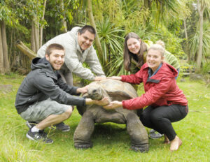 Vannasse and fellow research students pose with one of the Royal Melbourne Zoo's slower-paced residents.                                                   Courtesy