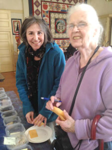 Reya Stevens (l) and Ruth Regan look over  seed samples                            Courtesy Nancy Arsenault