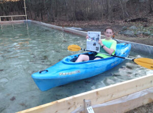 Cam Donahue took advantage of the family's melted ice rink to do some backyard kayaking.