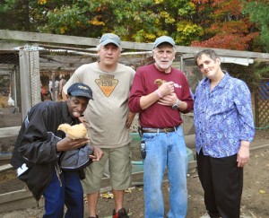 Pictured from left are TILL member Mark, “Farmer Frank” Gesualdi, John Stevens, Special Programs Director for TILL and TILL member, Debbie.                    Nancy Arsenault