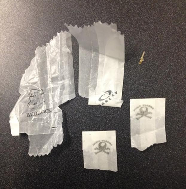   At right, heroin wrappers with symbols on them that usually identify a specific dealer, as reported by Stow police earlier this year. File photo