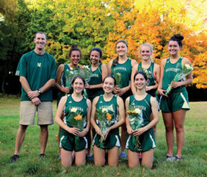 Coach Dan Glover with the senior girls on the Chieftain's Cross Country team.                                                                                                                     Susan Shaye; www.susanshaye.com