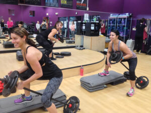 Kimberly Saart (l) and  Kim O'Brien warm up before the Power class at Global Fitness.                                                                                                 Nancy Arsenault