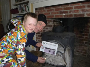 The Coppes family stayed home for school vacation :( and used the Stow Independent to start a fire to keep warm!  Pictured:  Peter Coppes and David Coppes 