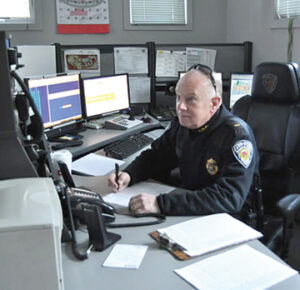 Lt. Rusty Marino at the dispatch desk                                                       Nancy Arsenault