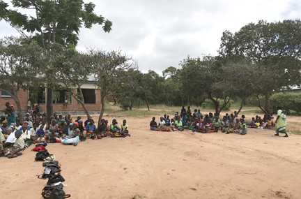 A line of patients waiting to be seen at a rural outreach clinic in Malawi, Africa Courtesy Don Hangen